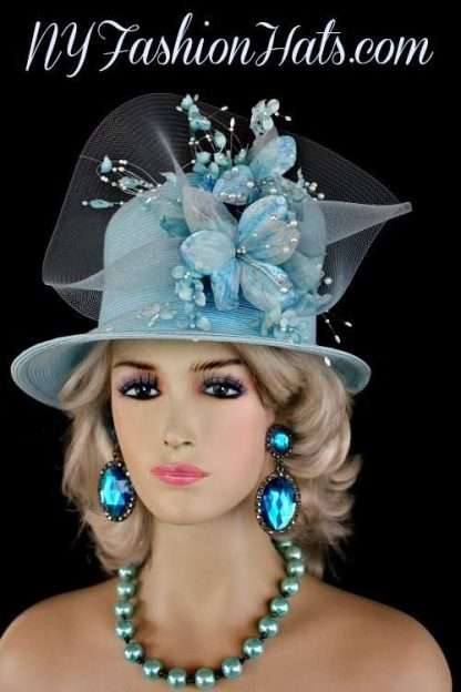 Ladies Soft Pastel Sky Blue Custom Made Straw Braid Designer Kentucky Derby Hat With Flowers. This Dress Shaped Hat Is Trimmed With Handmade Silk And Velvet Millinery Flowers, Accented With Sequin And Pearls, Adorned With A Large Baby Blue Crinoline Bow. This Feminine Designer Hat Has A Romantic Flair. A Perfect Dress Hat For A Wedding Guest. This Women's Hat Is Suited For Weddings, Church, Holidays, Formals, Garden Tea Parties, The Kentucky Derby, The Melbourne Cup, The Royal Ascot, Spring Horse Races, And Special Occasions. This Church Hat Is Custom Made And Designed By NY Fashion Hats, www.nyfashionhats.com