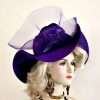 Women's Purple Designer Satin Braid Wide Wavy Brimmed Fashion Hat Adorned With A Large Purple Crinoline Bow, Enhanced With A Hand Made Velvet Millinery Flower. NY Fashion Hats, www.nyfashionhats.com Specialize In Designer Hats For Women, Hats For Weddings, Cocktail Hats, Haute Couture Hats For Women, High Fashion Hats, Hats For Brides, Kentucky Derby Hats, Preakness Stakes Hats, Belmont Stakes Hats, Royal Ascot Hats, Hats For Horse Races, World-Class Thoroughbred Horse Racing Hats, Custom Harness Racing Hats For The Racetrack, Melbourne Cup Hats, Del Mar Race Track, Santa Anita Park, Dubai World Cup, Virginia Gold Cup, Saratoga NY Racetrack, Hats For Casino Stage And Entertainment Shows, Hats For Formal Affairs. Garden Tea Party Hats, Mother Of The Bride Or Groom Hats, Church Hats, Easter Sunday Hats, And Hats For Dress-Up Events. Ladies Purple Wide Brimmed Satin Designer Dress Hat NY Fashion Hats